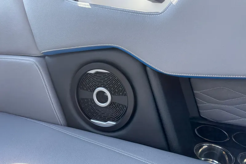 Slide: The Image of 2026 Supra SA 450 interior speaker detail with sleek design and cup holders. - 24