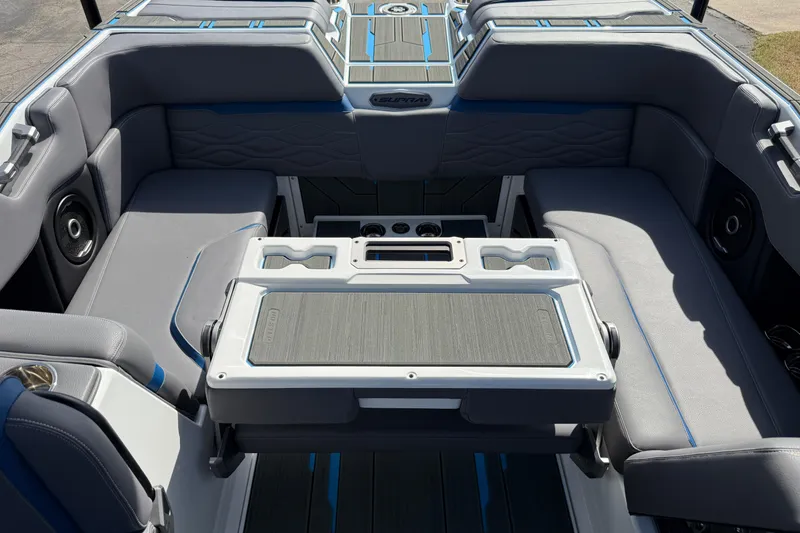 Slide: The Image of 2026 Supra SA 450 boat interior with gray seating and integrated cup holders. - 26