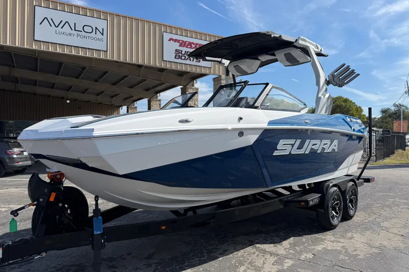 Slide: The Image of 2026 Supra SA 450 boat displayed outside Avalon Luxury Pontoons dealership. - 3