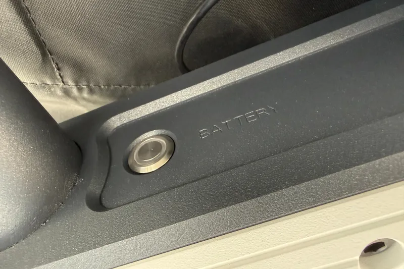 Slide: The Image of Close-up of 2026 Supra SA 450 battery compartment with button detail. - 32