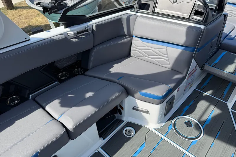 Slide: The Image of 2026 Supra SA 450 boat interior with gray and blue seating, modern design. - 37