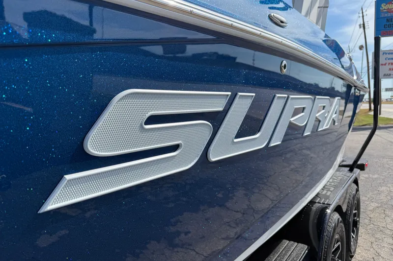 Slide: The Image of 2026 Supra SA 450 boat with metallic blue finish and bold logo. - 4