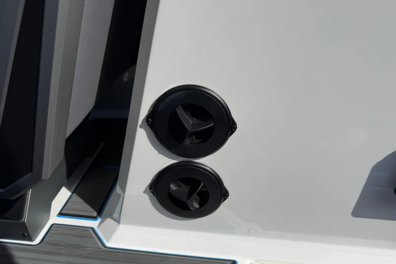 Slide: The Image of 2026 Supra SA 450 boat detail showing dual black vents on white surface. - 41