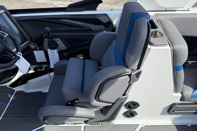 Slide: The Image of Captain's seat in 2026 Supra SA 450 boat, featuring sleek design and modern controls. - 42