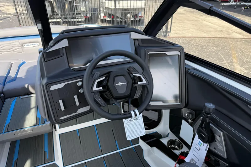 Slide: The Image of 2026 Supra SA 450 boat dashboard with modern steering and digital displays. - 43