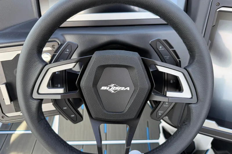 Slide: The Image of Steering wheel of 2026 Supra SA 450 with integrated controls and modern design. - 44