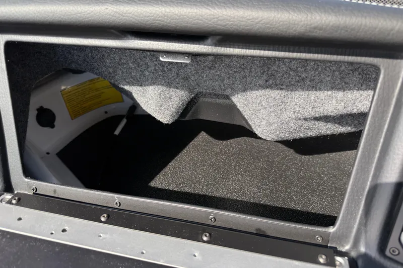 Slide: The Image of Interior compartment of 2026 Supra SA 450 boat, featuring textured lining and storage space. - 49