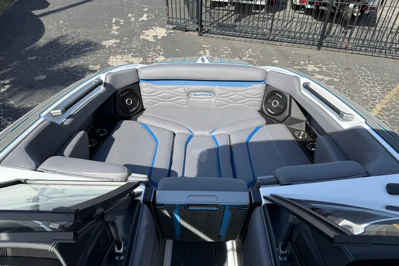 Slide: The Image of 2026 Supra SA 450 boat interior with gray seating and integrated speakers. - 51