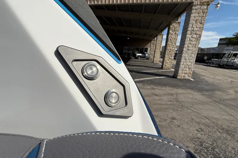 Slide: The Image of Close-up of 2026 Supra SA 450 boat controls with retract and deploy buttons. - 57