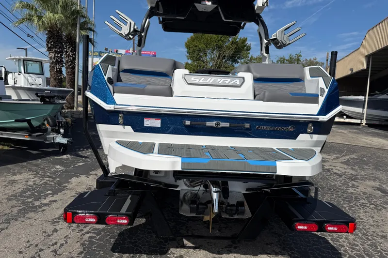 Slide: The Image of 2026 Supra SA 450 boat rear view, featuring sleek design and modern features. - 9