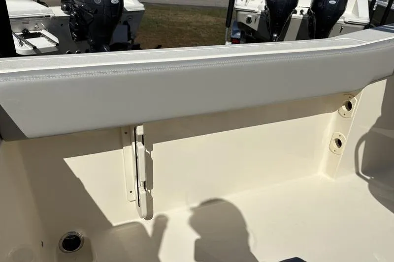 Slide: The Image of 2026 Scout 240 XSF boat interior detail with seating and engine view. - 13