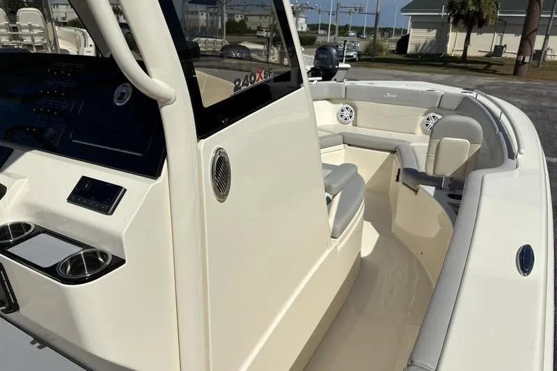 Slide: The Image of 2026 Scout 240 XSF boat interior with seating and control panel. - 24