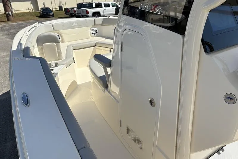 Slide: The Image of 2026 Scout 240 XSF boat interior with seating and storage compartments. - 25