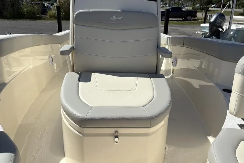 Slide: The Image of 2026 Scout 240 XSF boat interior with cushioned seating and armrests. - 29