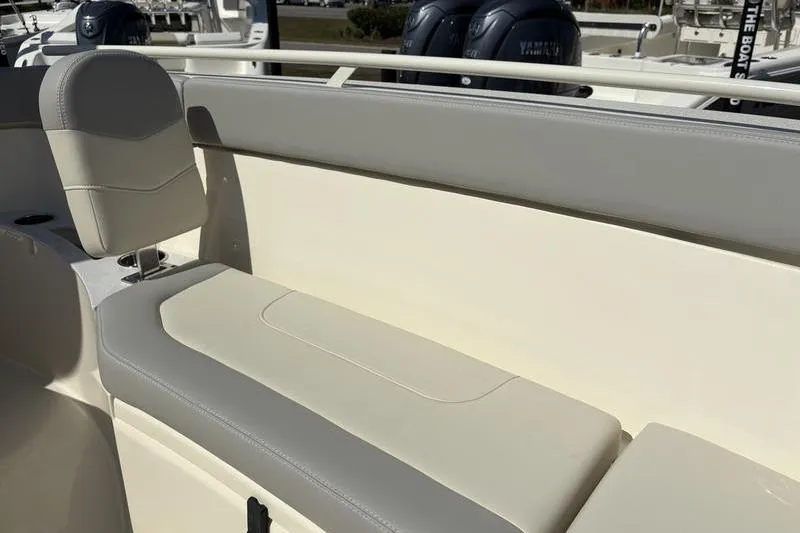 Slide: The Image of 2026 Scout 240 XSF boat interior with cushioned seating and modern design. - 32