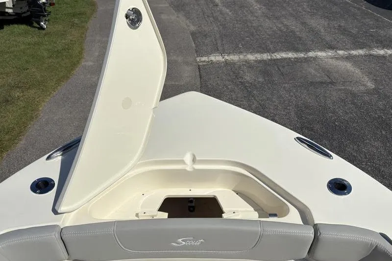 Slide: The Image of 2026 Scout 240 XSF boat bow with open storage compartment and seating. - 35