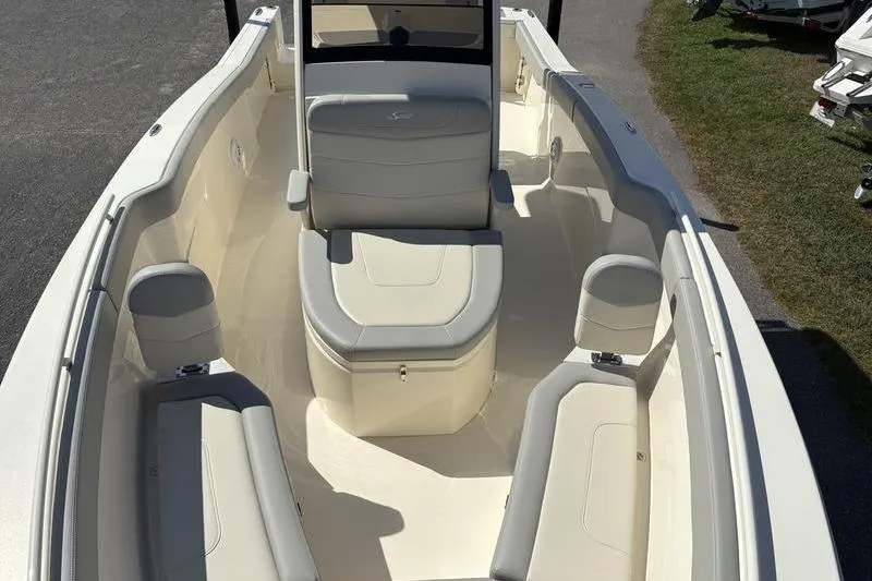 Slide: The Image of 2026 Scout 240 XSF boat interior with cushioned seating and sleek design. - 36