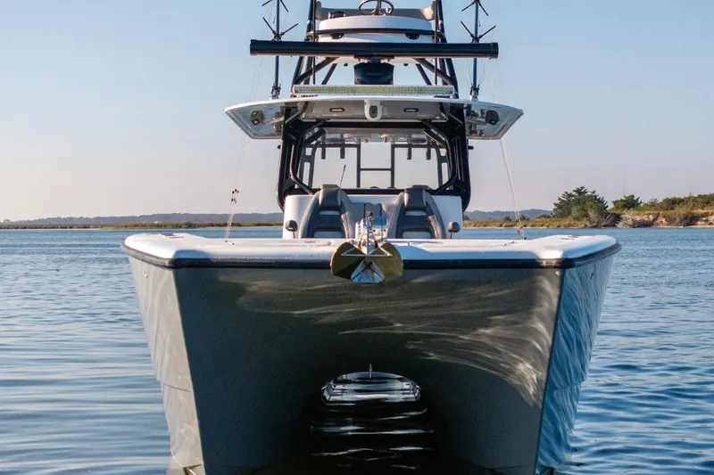 Slide: The Image of Front view of 2022 Freeman 42 LR boat on calm water. - 11