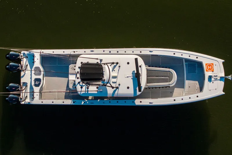 Slide: The Image of Aerial view of 2022 Freeman 42 LR boat with multiple outboard engines. - 12