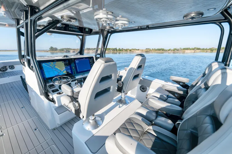 Slide: The Image of Interior of 2022 Freeman 42 LR boat with advanced navigation system and luxurious seating. - 14
