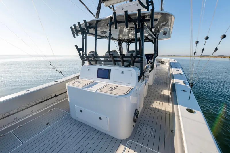 Slide: The Image of 2022 Freeman 42 LR boat with sleek deck design and advanced fishing equipment. - 18