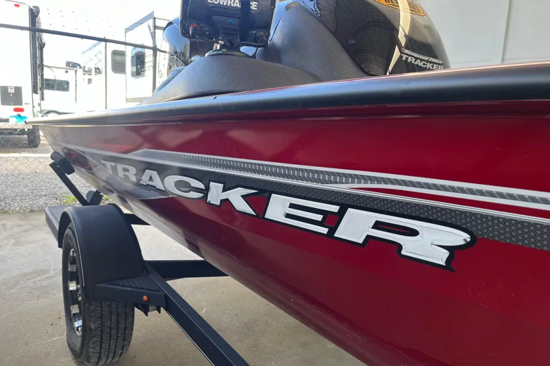 Slide: The Image of 2021 Bass Tracker Pro Team 195 TXW TE boat, red exterior, close-up view. - 10