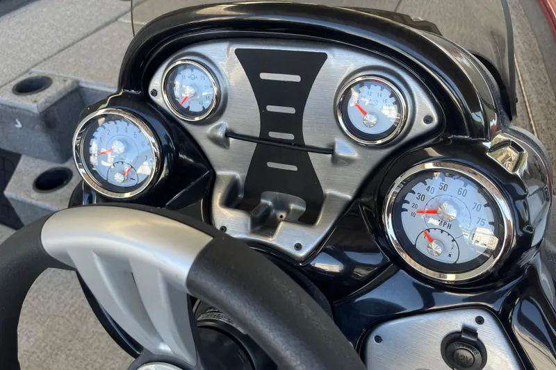 Slide: The Image of Dashboard of 2021 Bass Tracker Pro Team 195 TXW TE with gauges and steering wheel. - 14
