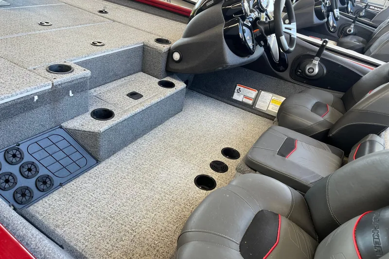 Slide: The Image of 2021 Bass Tracker Pro Team 195 TXW TE interior with gray carpet and seating. - 19