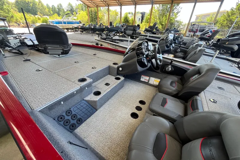 Slide: The Image of 2021 Bass Tracker Pro Team 195 TXW TE boat interior with seating and steering console. - 20