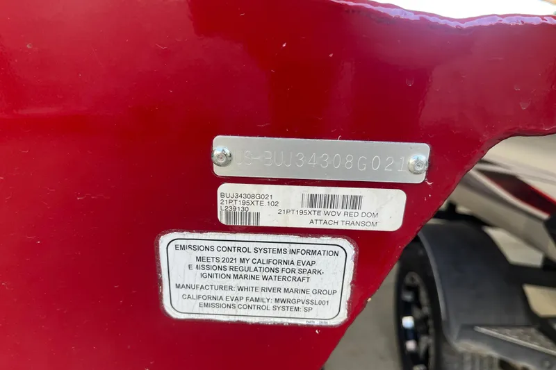 Slide: The Image of 2021 Bass Tracker Pro Team 195 TXW TE, red transom with emissions control information. - 24