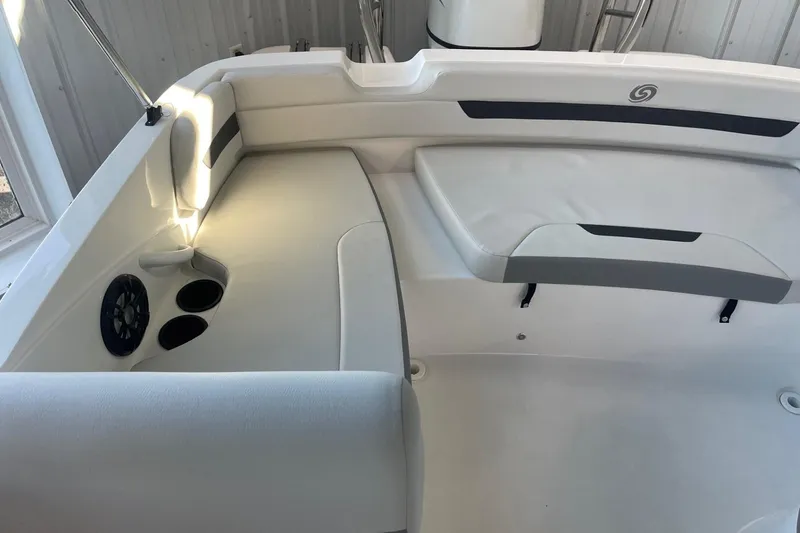 Slide: The Image of 2023 Hurricane SunDeck Sport 185 OB interior with seating and cup holders. - 13