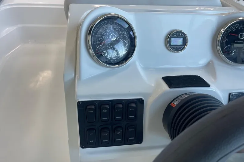 Slide: The Image of Dashboard of 2023 Hurricane SunDeck Sport 185 OB boat with gauges and controls. - 15