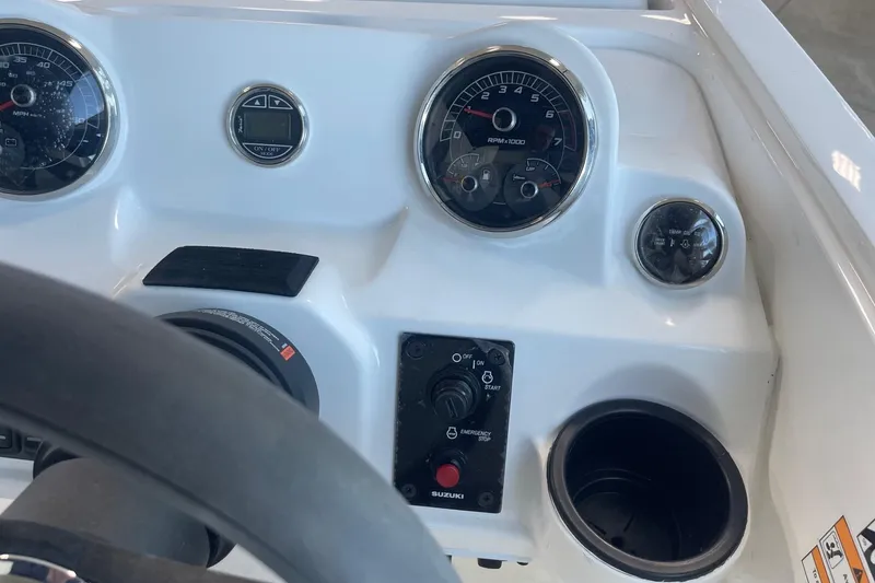 Slide: The Image of 2023 Hurricane SunDeck Sport 185 OB dashboard with gauges and controls. - 16