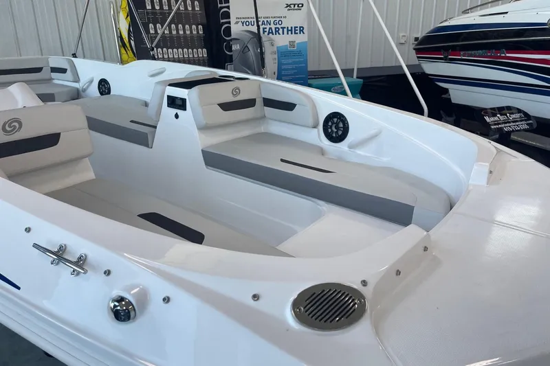 Slide: The Image of 2023 Hurricane SunDeck Sport 185 OB interior with gray seating and modern design. - 2