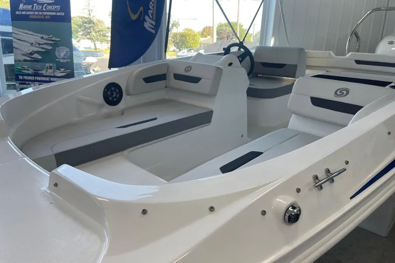 Slide: The Image of 2023 Hurricane SunDeck Sport 185 OB boat interior with seating and steering wheel in showroom. - 3