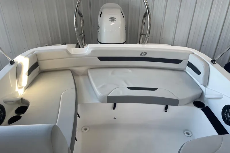 Slide: The Image of 2023 Hurricane SunDeck Sport 185 OB boat interior with cushioned seating and cup holders. - 8