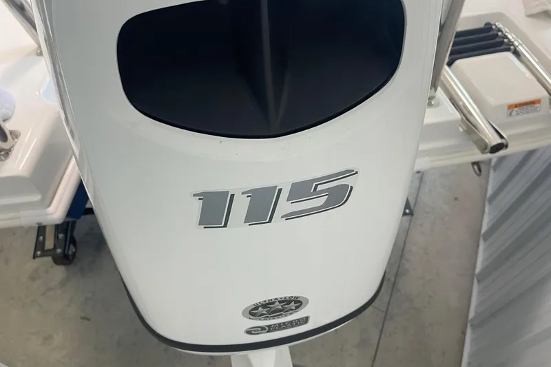 Slide: The Image of 2023 Hurricane SunDeck Sport 185 OB outboard motor with "115" horsepower label. - 9