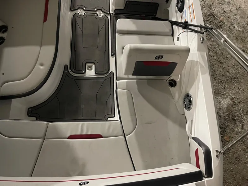 Slide: The Image of 2022 Hurricane SunDeck Sport 205 IO boat interior with cushioned seating and non-slip flooring. - 10