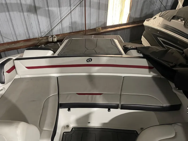 Slide: The Image of 2022 Hurricane SunDeck Sport 205 IO boat interior with gray and red seating. - 17