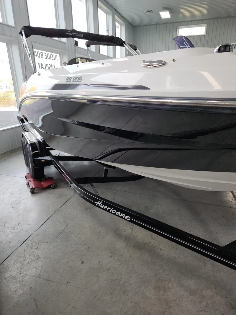 Slide: The Image of 2022 Hurricane SunDeck Sport 205 IO boat in showroom. - 5