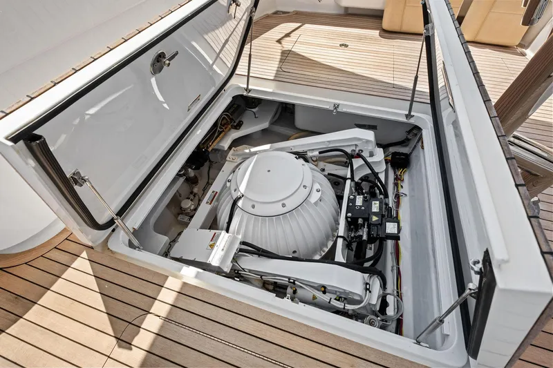 Slide: The Image of 2017 Viking 62 Enclosed Bridge yacht engine compartment with advanced machinery and wiring. - 10