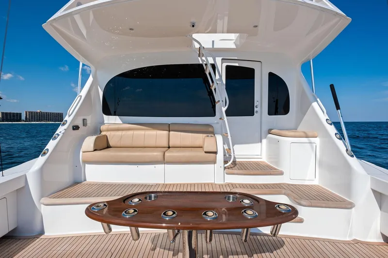 Slide: The Image of Luxurious 2017 Viking 62 Enclosed Bridge yacht deck with seating and ocean view. - 12