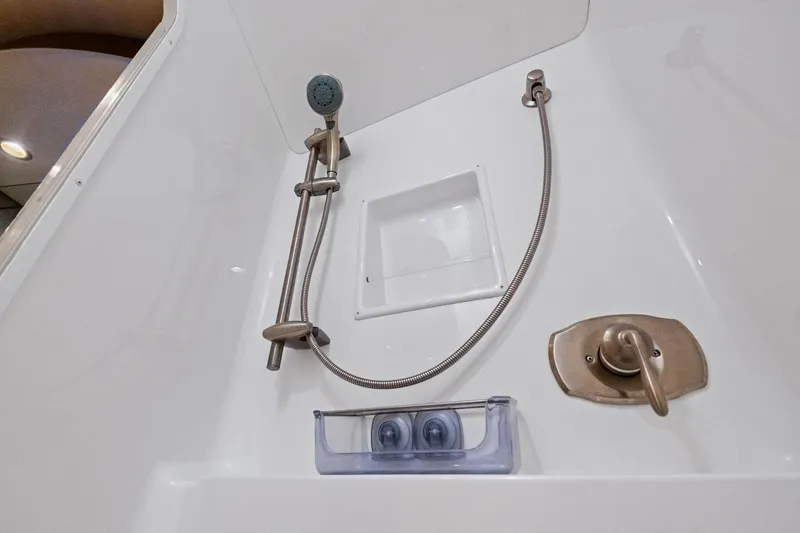 Slide: The Image of Shower area in 2017 Viking 62 Enclosed Bridge yacht with modern fixtures. - 39