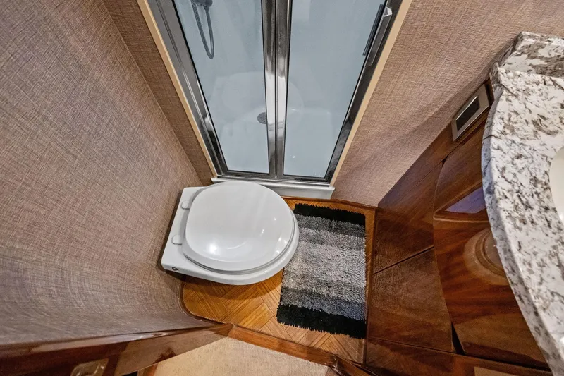 Slide: The Image of Bathroom interior of 2017 Viking 62 Enclosed Bridge yacht with shower and toilet. - 43