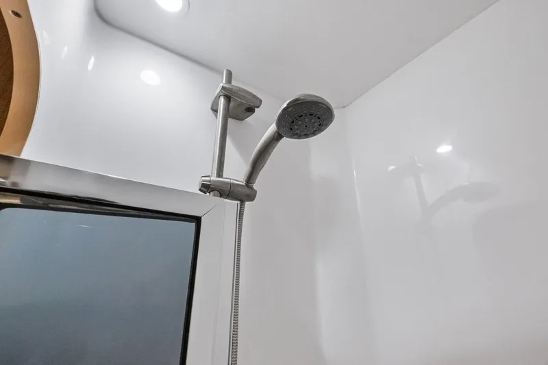 Slide: The Image of Shower area in 2017 Viking 62 Enclosed Bridge yacht, featuring modern fixtures. - 44