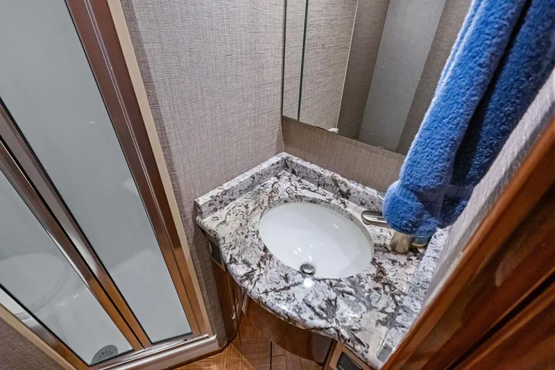 Slide: The Image of Luxurious bathroom sink in 2017 Viking 62 Enclosed Bridge yacht. - 48