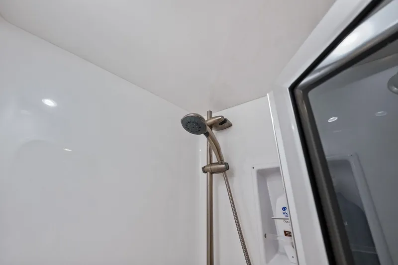 Slide: The Image of Shower area in 2017 Viking 62 Enclosed Bridge yacht, featuring modern fixtures. - 50