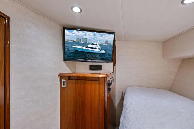 Slide: The Image of Interior of 2017 Viking 62 Enclosed Bridge with TV and bed. - 52