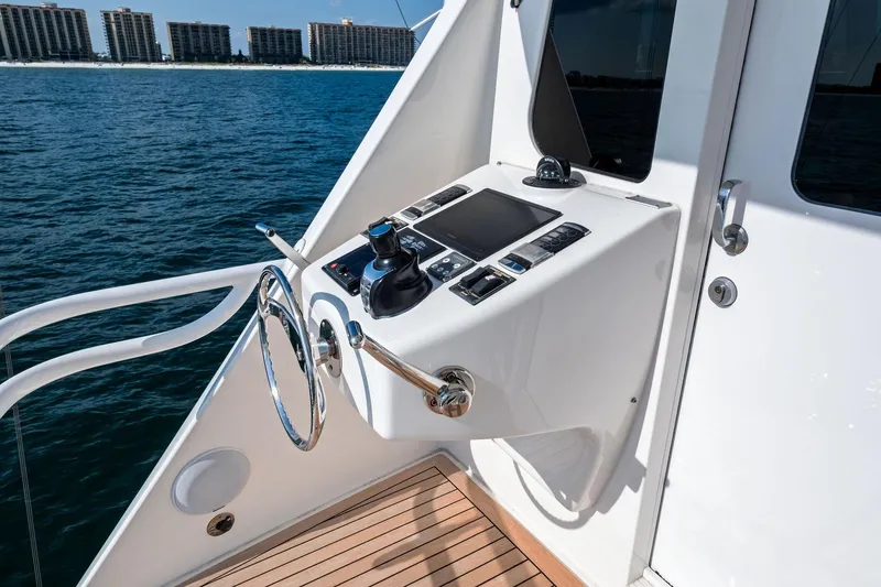 Slide: The Image of Control panel of 2017 Viking 62 Enclosed Bridge yacht with ocean view. - 61