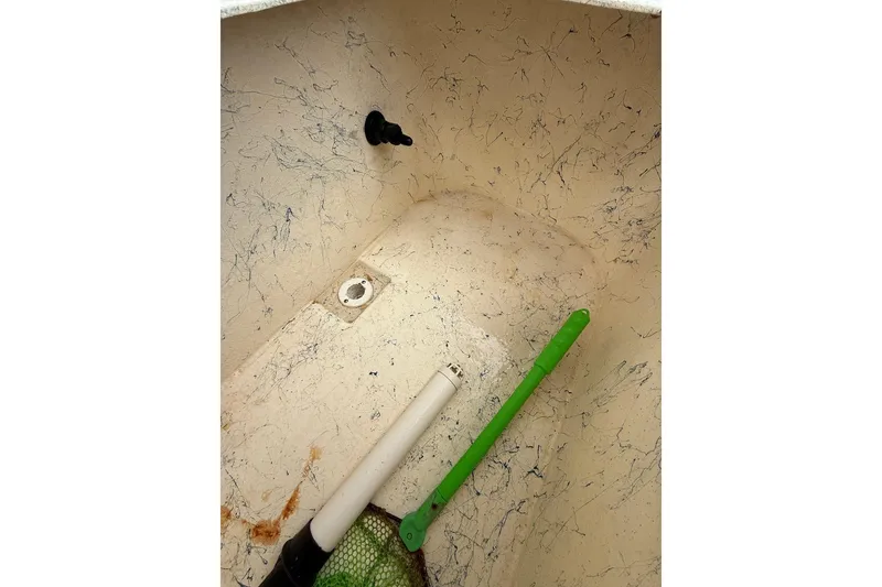 Slide: The Image of Interior of 2014 Privateer ROAMER II boat with cleaning tools. - 7